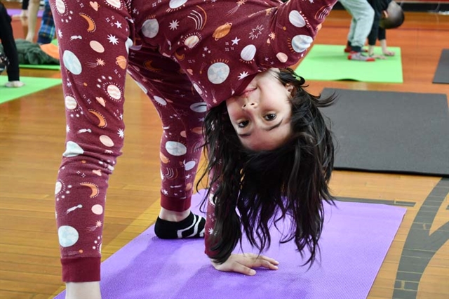 students practicing yoga