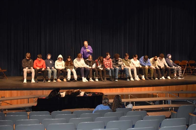 students on stage participating in hypnotism