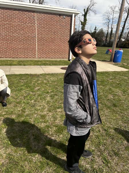 Students viewing solar eclipse