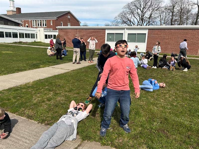 students viewing solar eclipse
