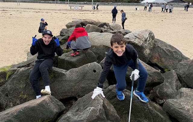 Students on rock smiling