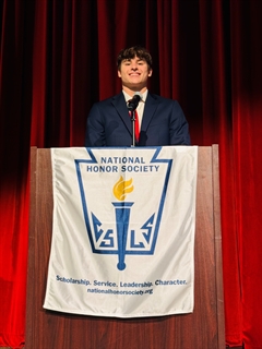 student speaking at podium