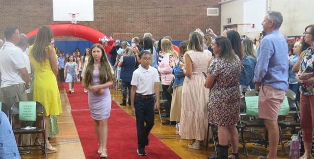 students walking from stage