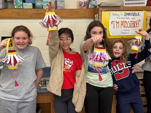 Candice and classmates with lanterns