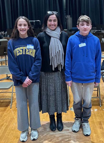 Teacher and students smiling