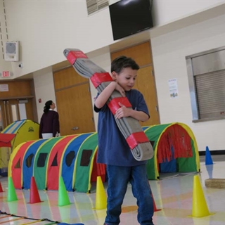 Students using obstacle course