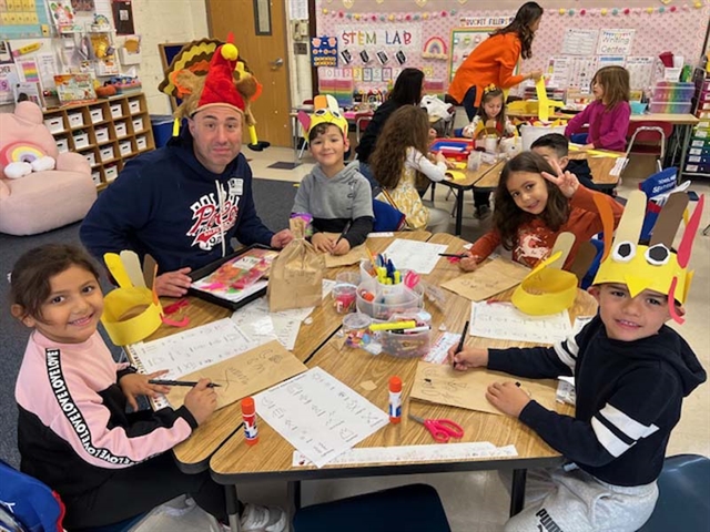 students at table smiling