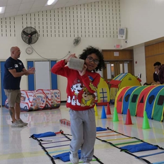 Students using obstacle course