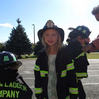 Students dressed as firefighters