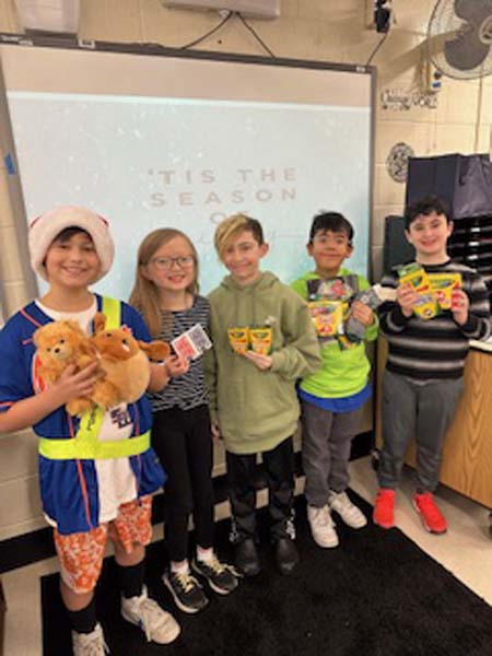 Students holding gifts to give out