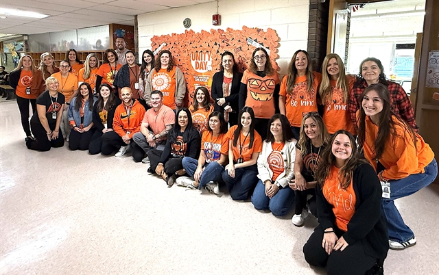 staff in orange