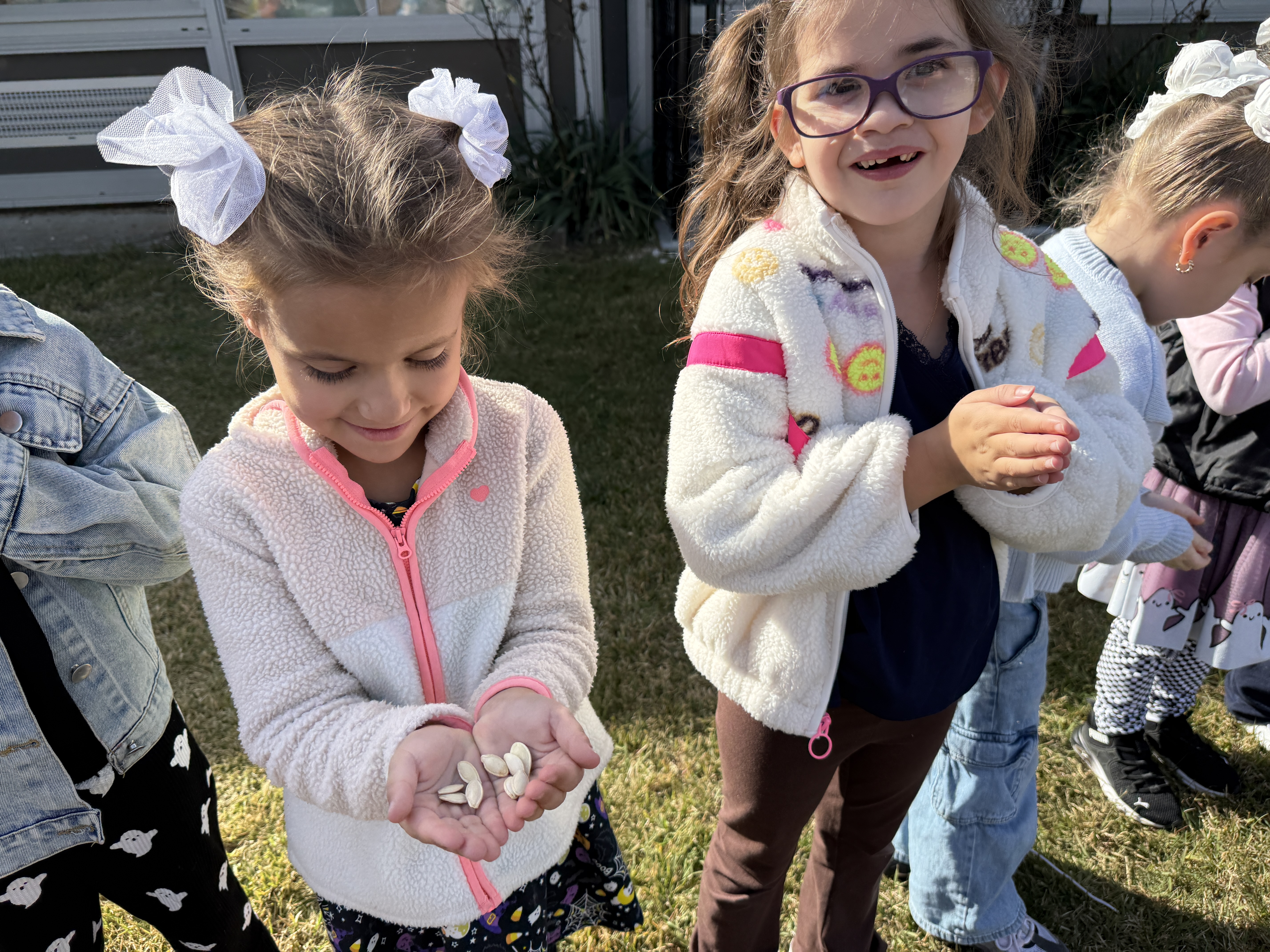 students with pumpkin seeds