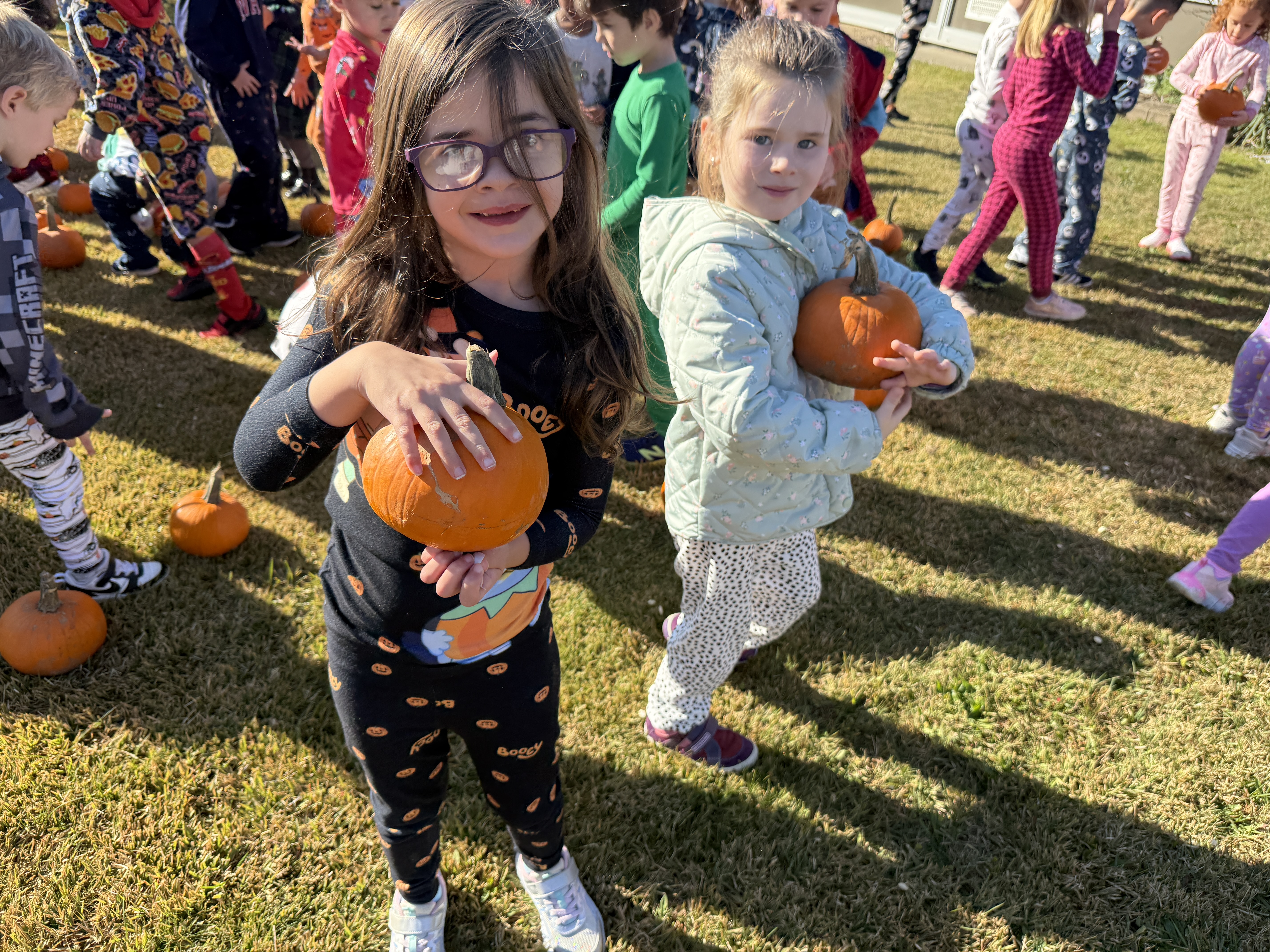 student with a pumpkin
