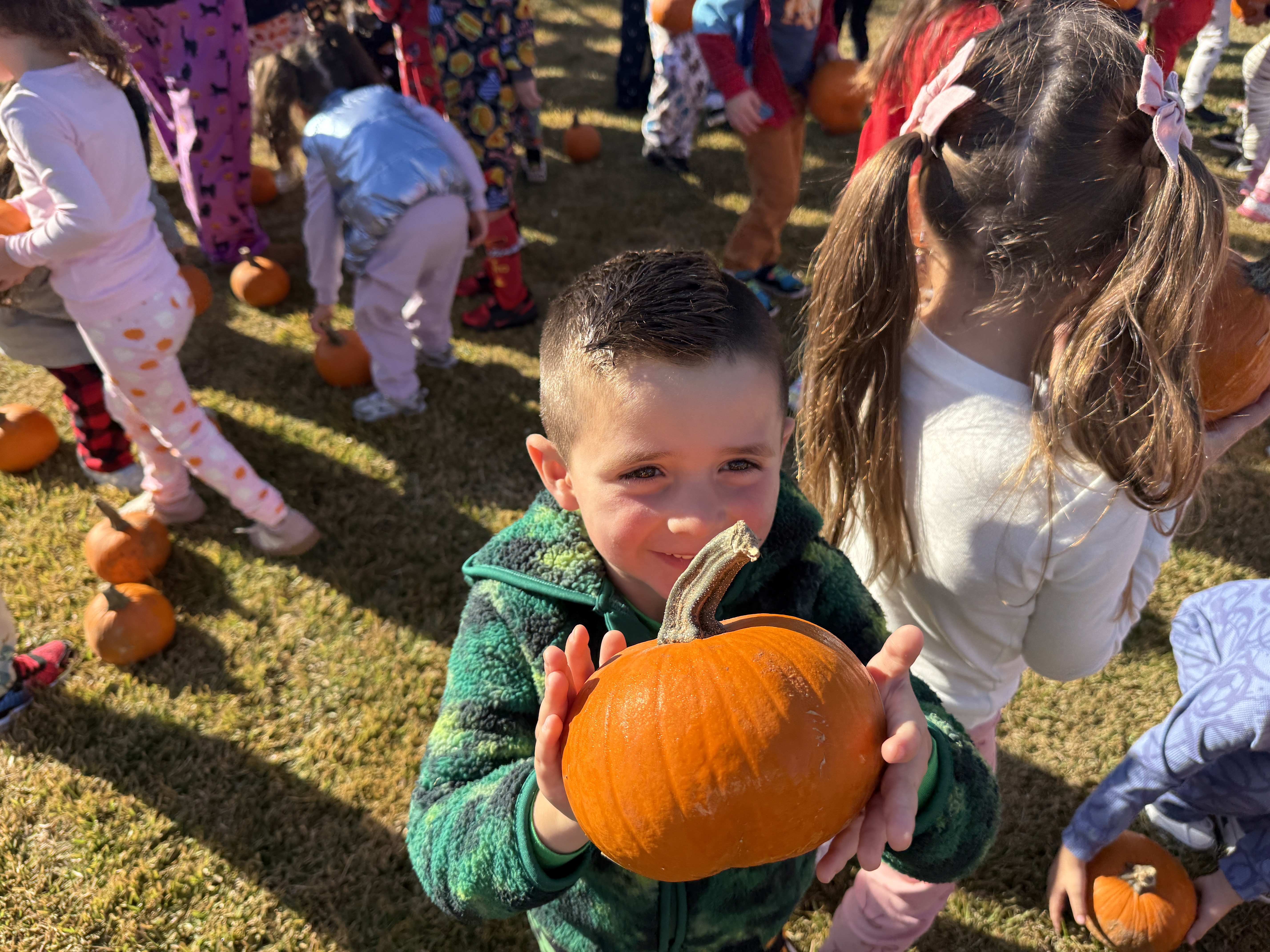student with a pumpkin