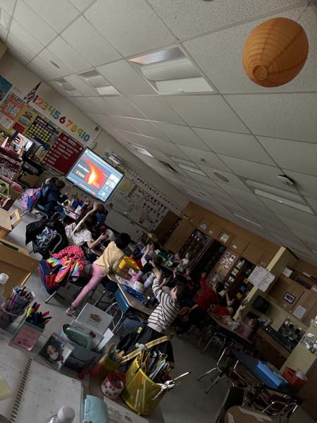 students in class learning about the eclipse