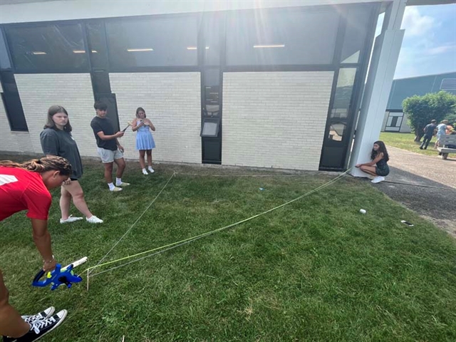 students conducting science experiment