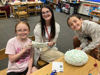 students crocheting