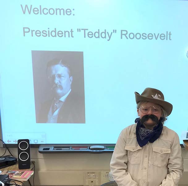 student posing for picture dressed up