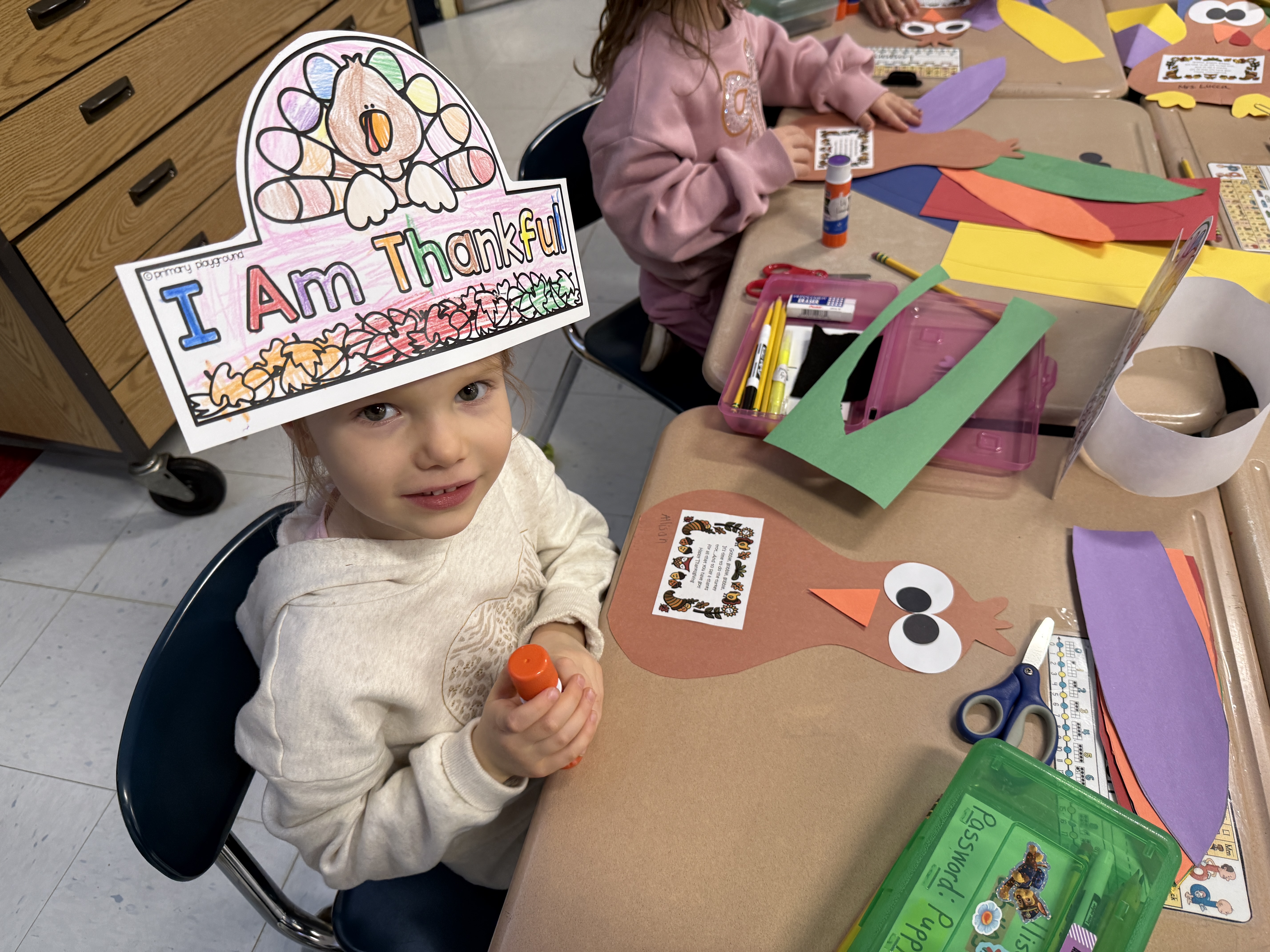 Parents and children doing thanksgiving crafts