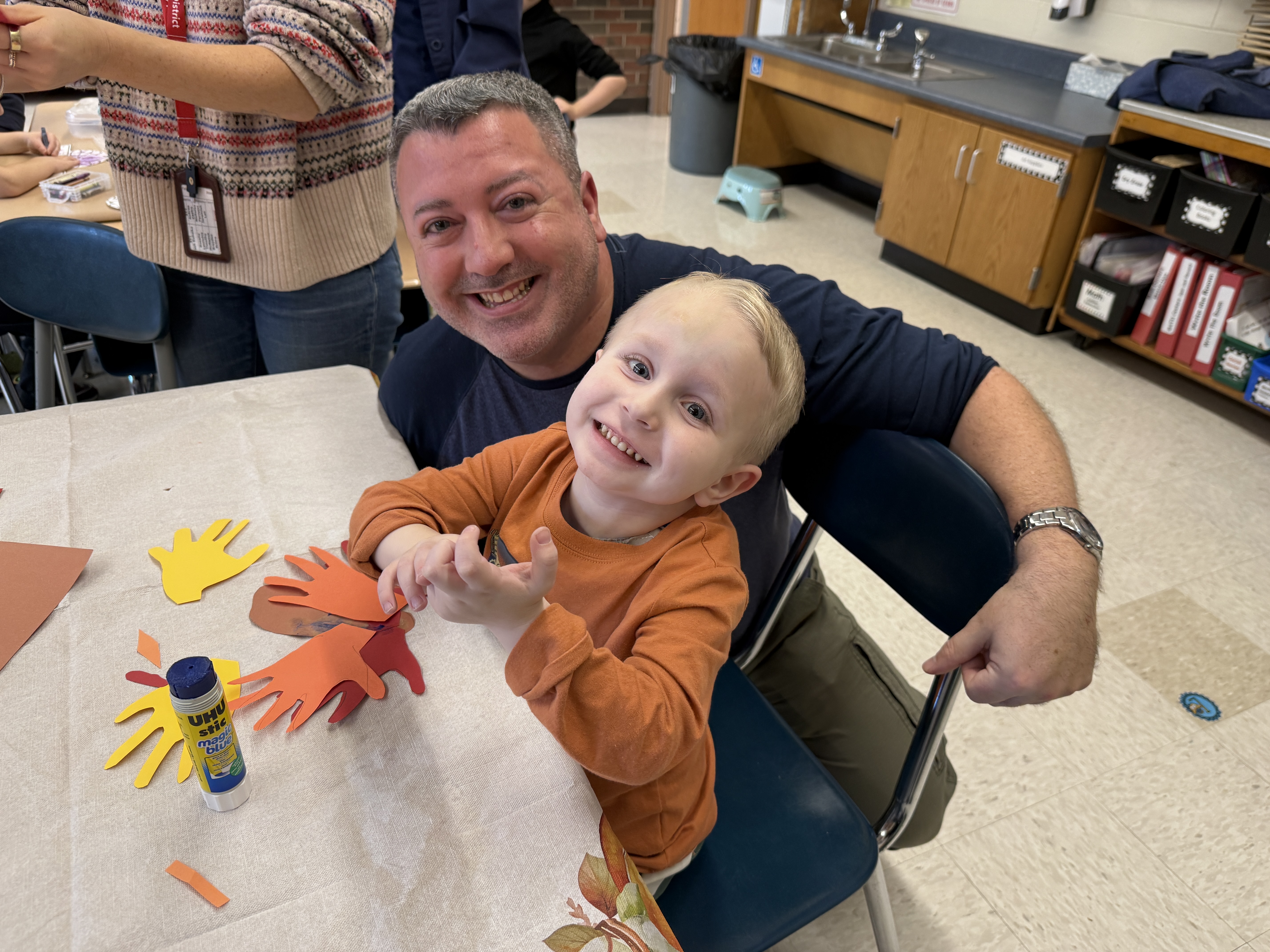 Parents and children doing thanksgiving crafts