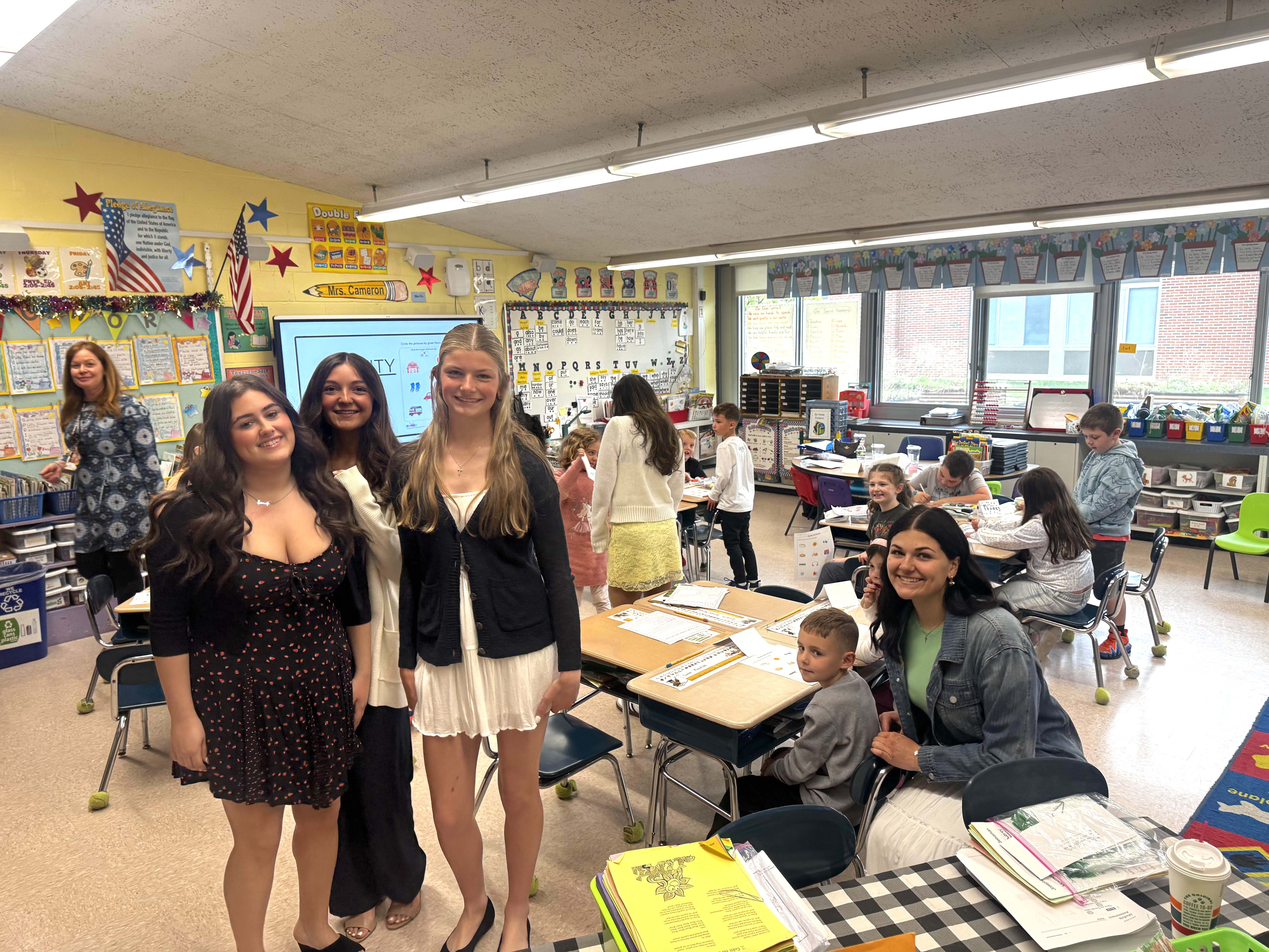 students in classroom smiling
