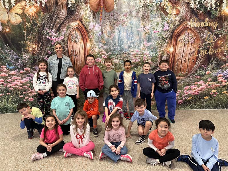 students and parents posing for picture