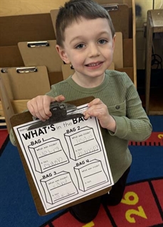 Student holding a sign