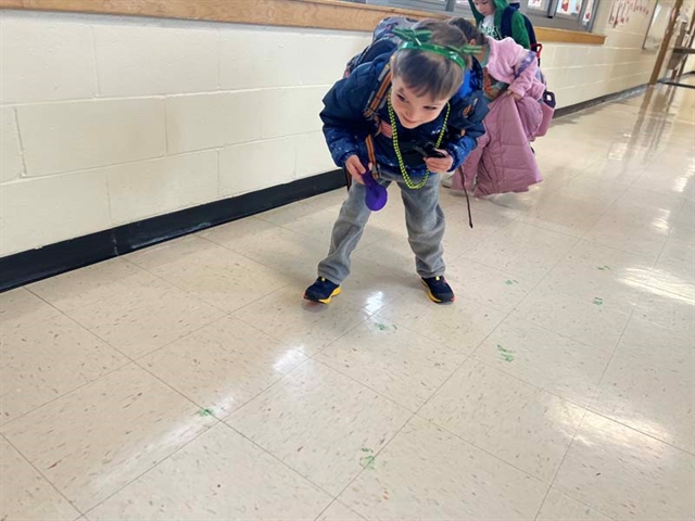 student finding green footprints