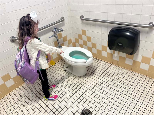 a green toilet bowl