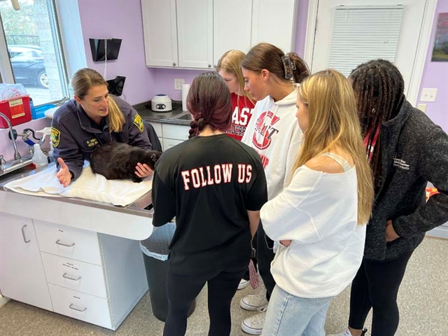 High School students petting animal