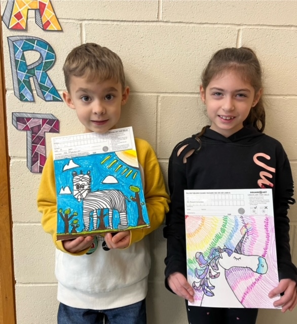 Children holding artwork