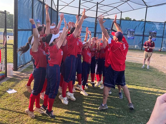 softball team celebrating