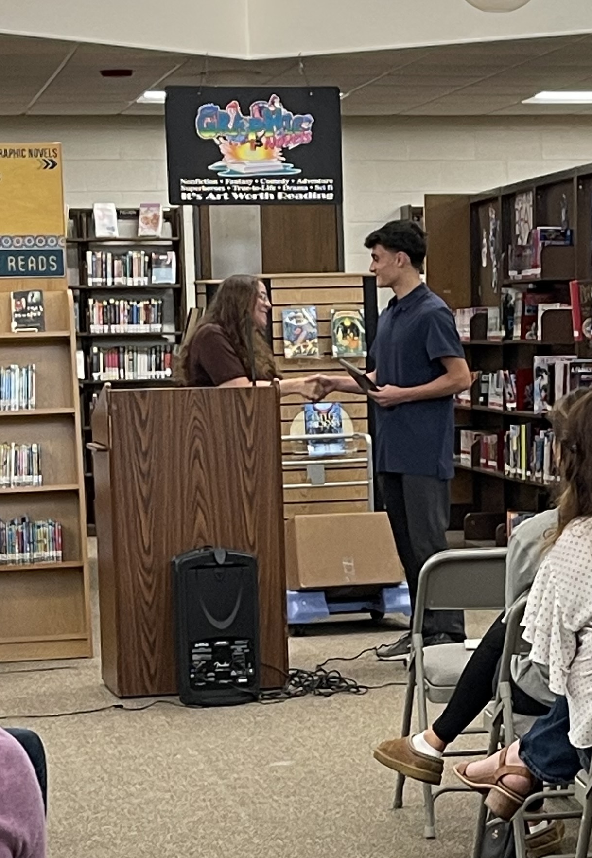 Student receiving award