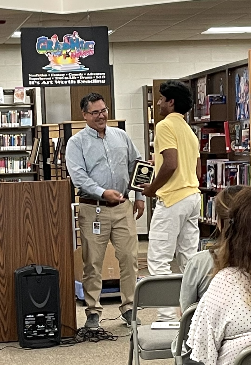 Student receiving award