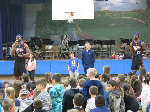 Harlem Wizards with students