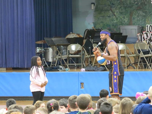 Harlem Wizards with students