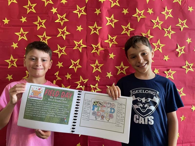 Students holding book