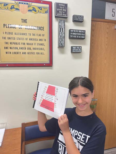 Student holding book