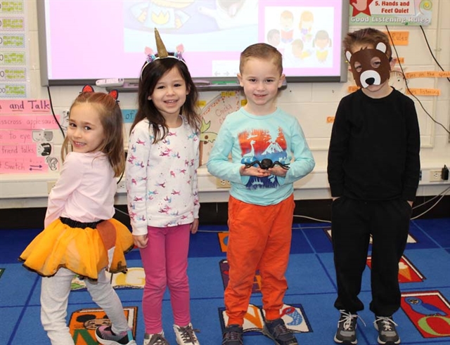 students and teachers smiling for picture