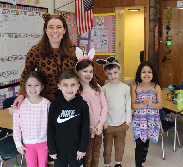 students and teachers smiling for picture