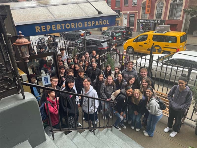 Students smiling for group photo in NYC