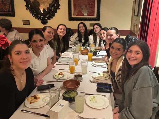 Students smiling for group photo in NYC