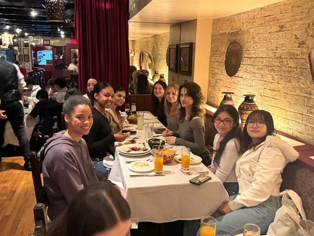 Students smiling for group photo in NYC