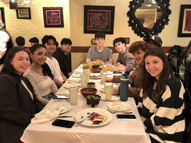 Students smiling for group photo in NYC