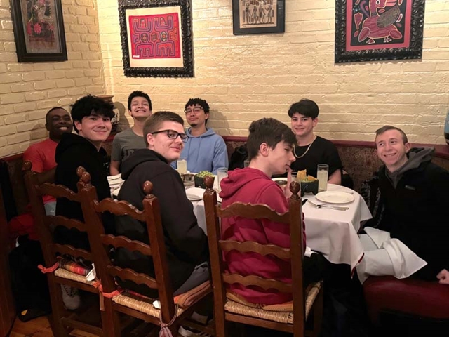 Students smiling for group photo in NYC