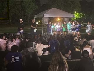 students gathering at night