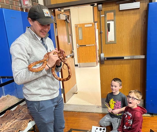 man holding a snake