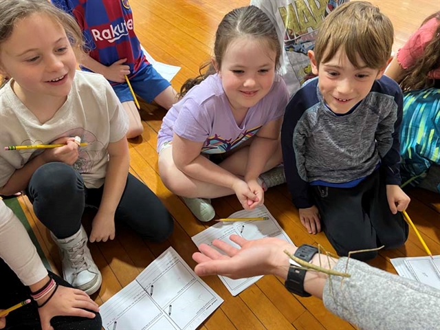 kids looking at insects