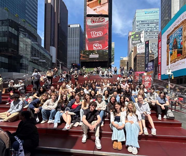 students smiling for picture in NYC