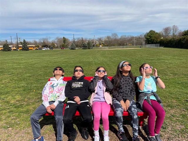 students watching the eclipse